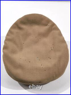 U. S. WWII Army tan service cap for officers. Some month holes, loose visor, size